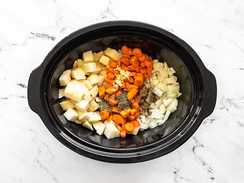 Vegetables herbs and spices in the slow cooker