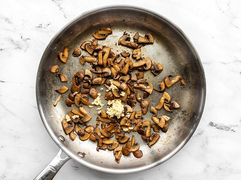 Sautéed mushrooms and garlic in the skillet