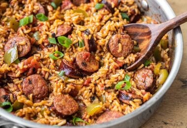 Side view of a skillet full of Cajun Sausage and Rice
