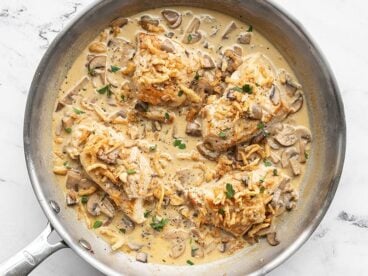 Finished Creamy Mushroom Chicken with Crispy Onions, garnished with parsley