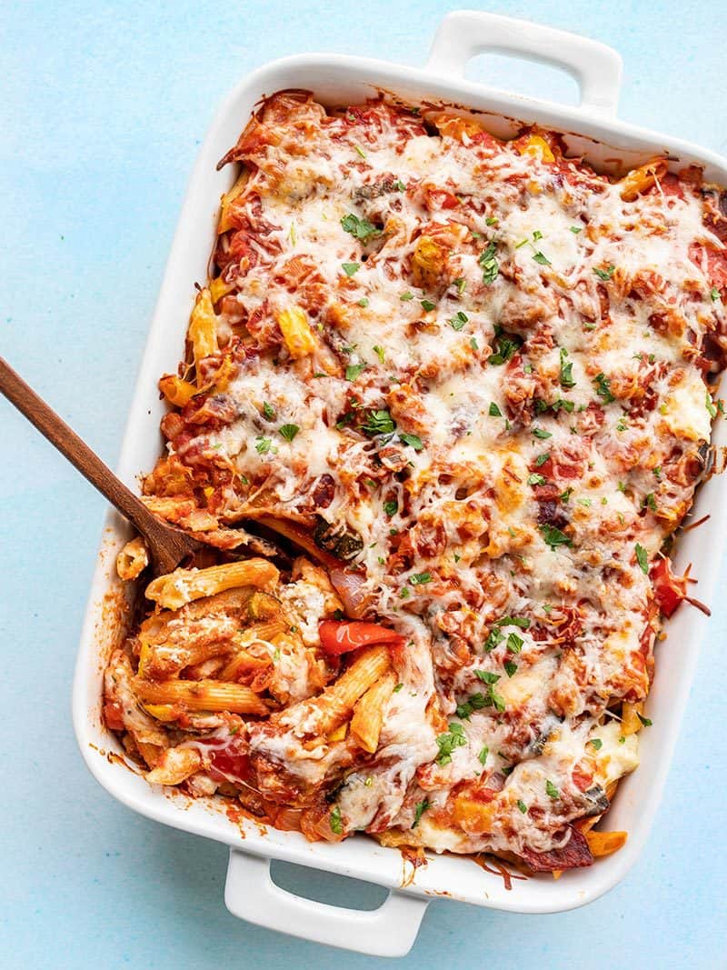 Overhead view of a casserole dish full of roasted vegetable baked penne