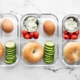 Three bagel lunch boxes lined up in a row