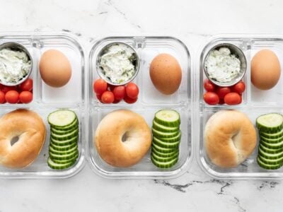 Three bagel lunch boxes lined up in a row