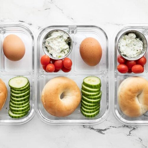 Three bagel lunch boxes lined up in a row