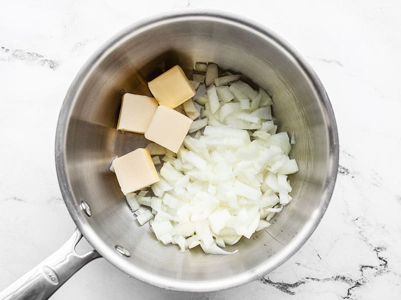 Onion and butter in sauce pot