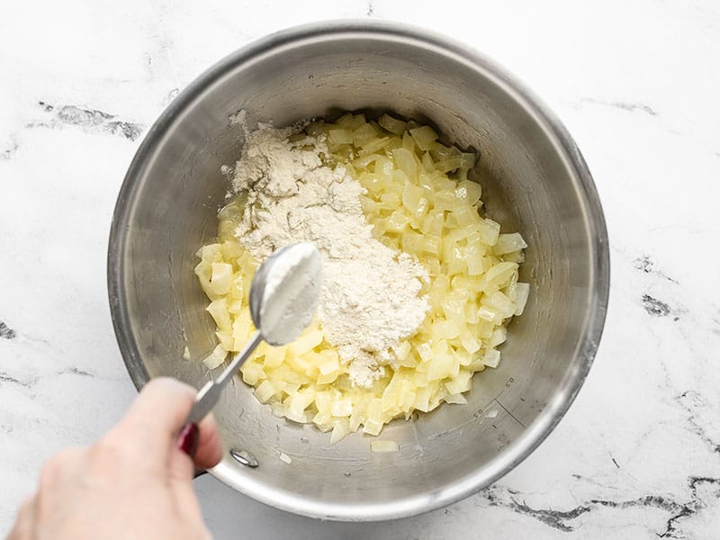 Flour added to pot with sautéed onions