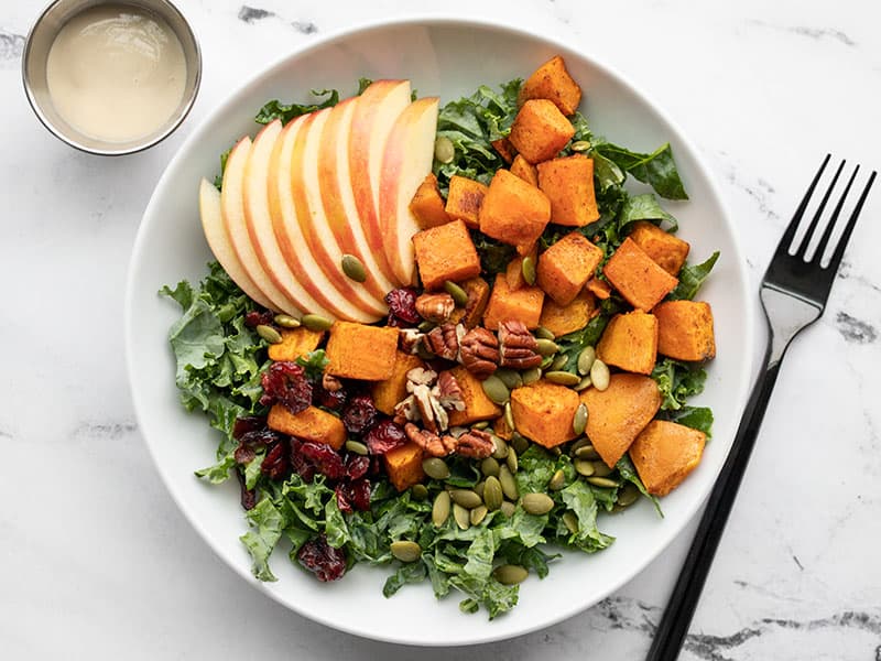 cranberries, seeds, and nuts added to the salad