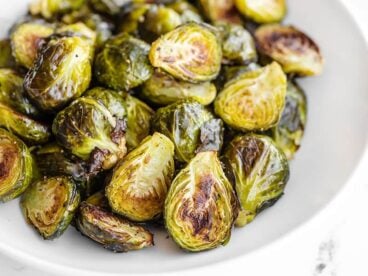 Close up side view of Roasted Brussels Sprouts in a bowl
