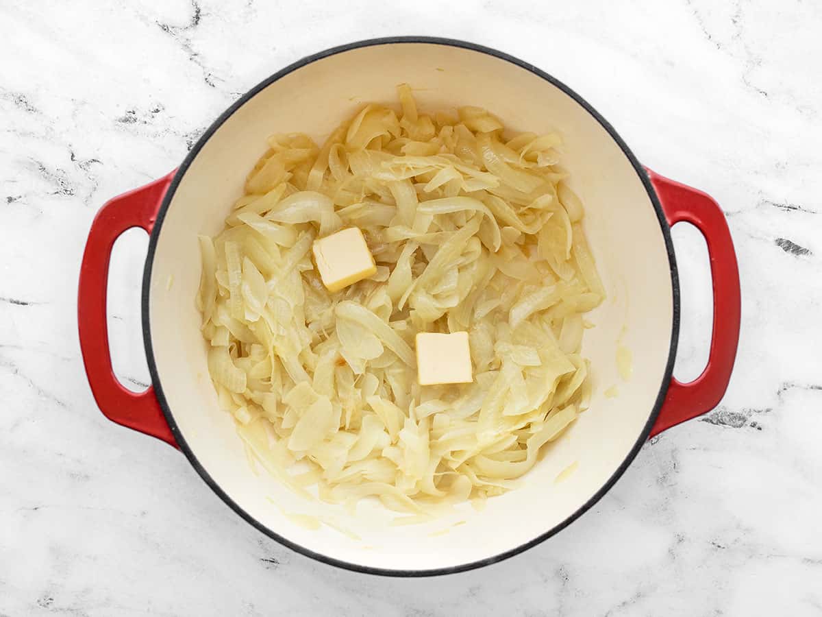 Add butter to golden onions in the soup pot