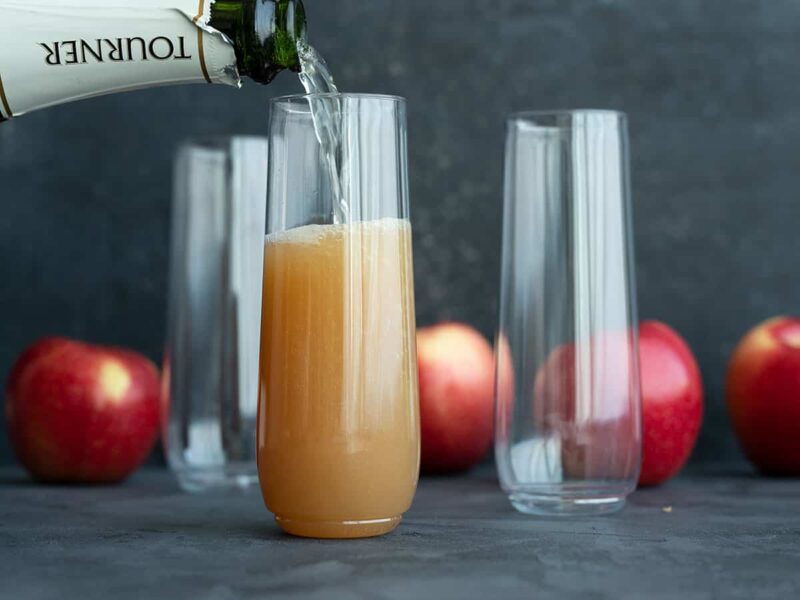 Sparkling wine being poured into a flute with cider