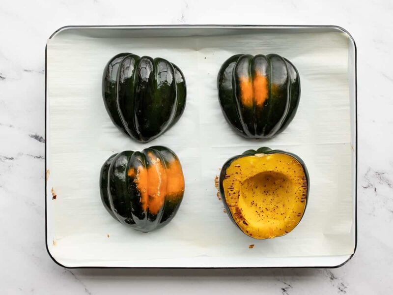 roasted acorn squash on the baking sheet