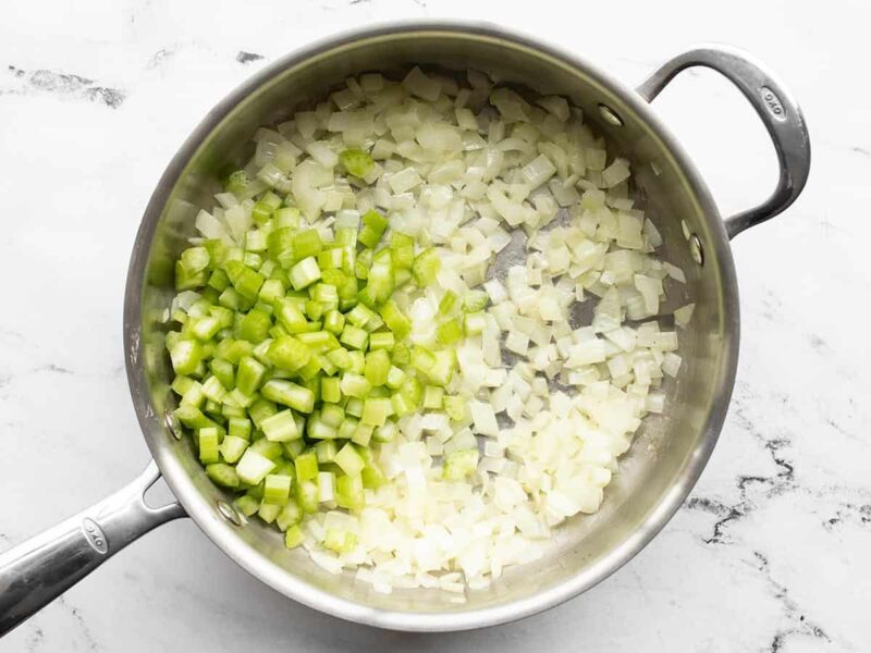 Diced celery added to skillet