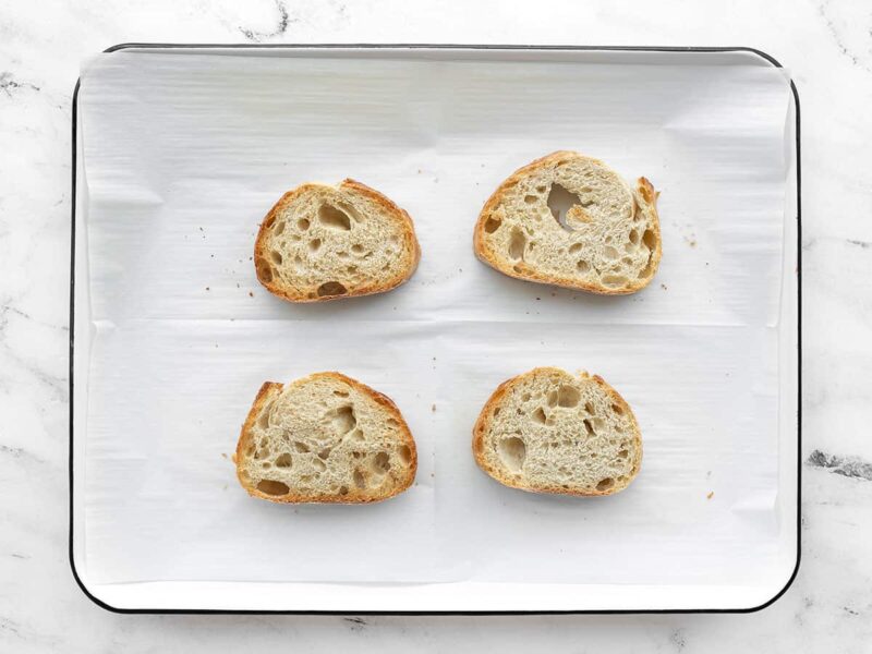 Toasted bread on a baking sheet