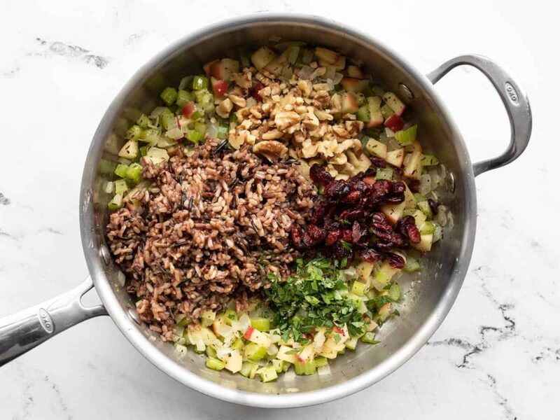 Wild rice, walnuts, cranberries, and parsley added to the pot