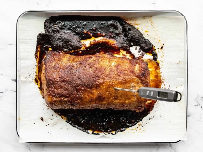 Roasted pork loin with a meat thermometer in it