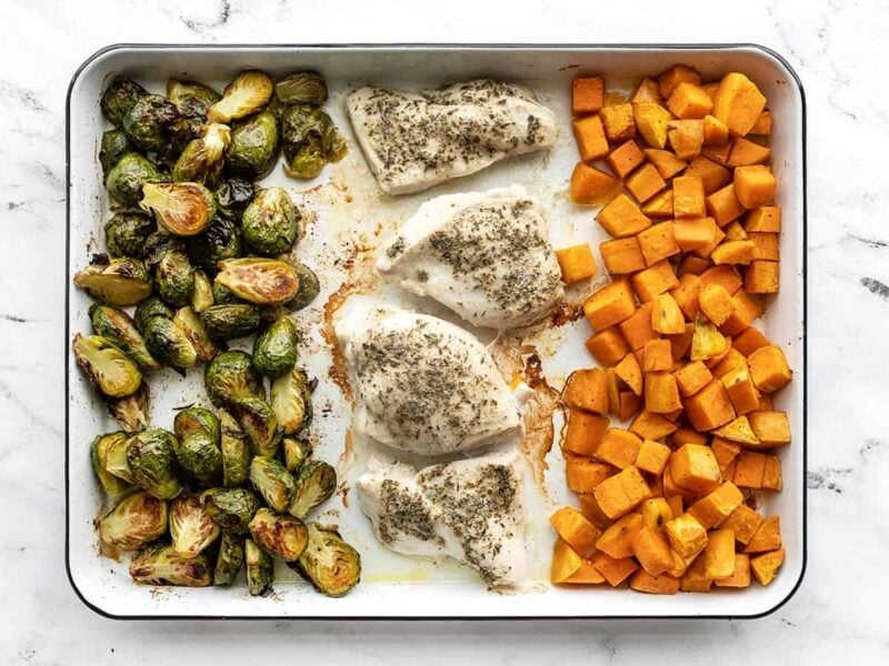 Baked chicken and vegetables on the baking sheet