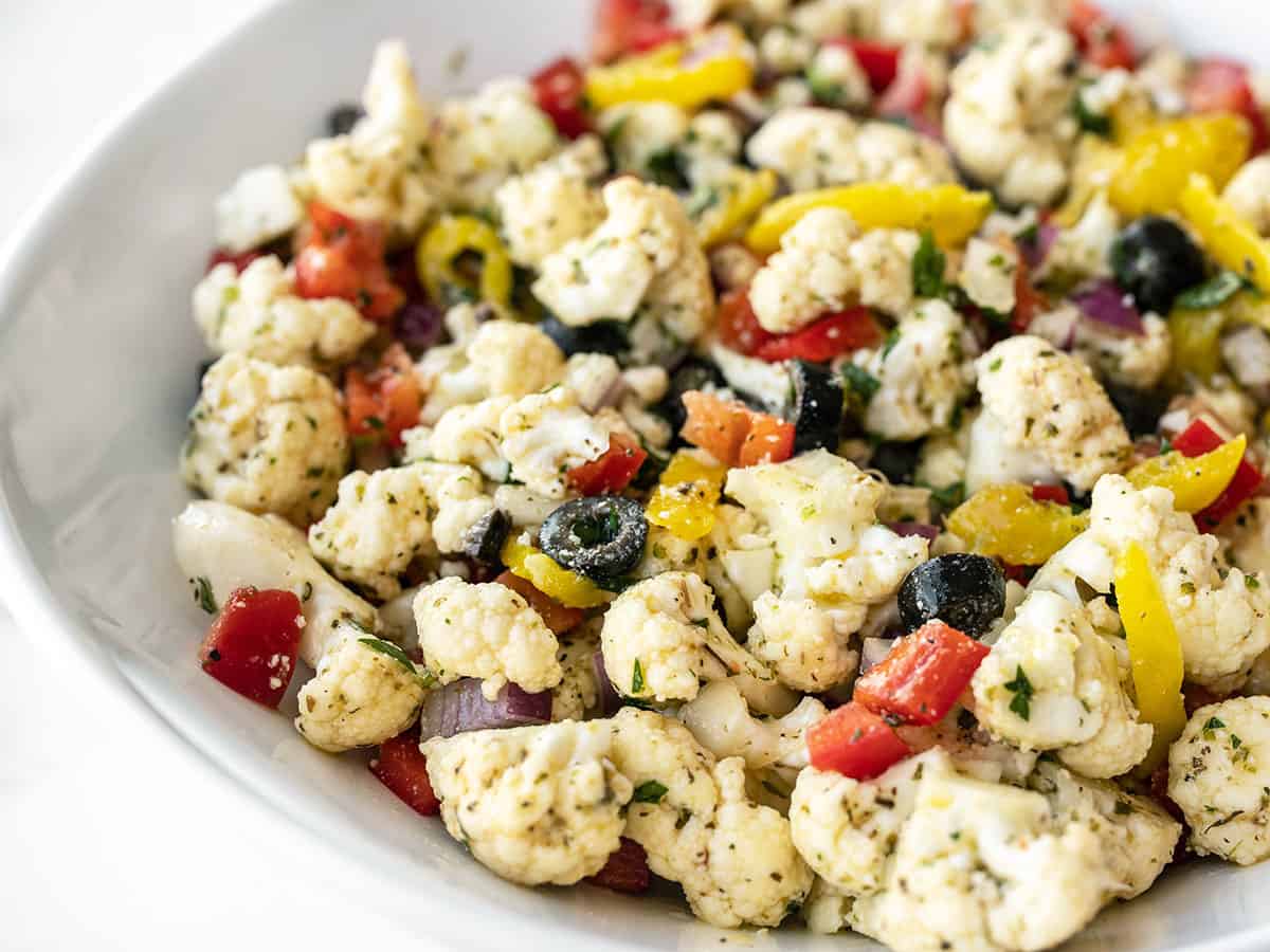 Side view of marinated cauliflower salad in a serving bowl