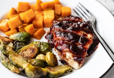 Sheet Pan Cranberry Chicken Dinner on a plate, viewed from the side