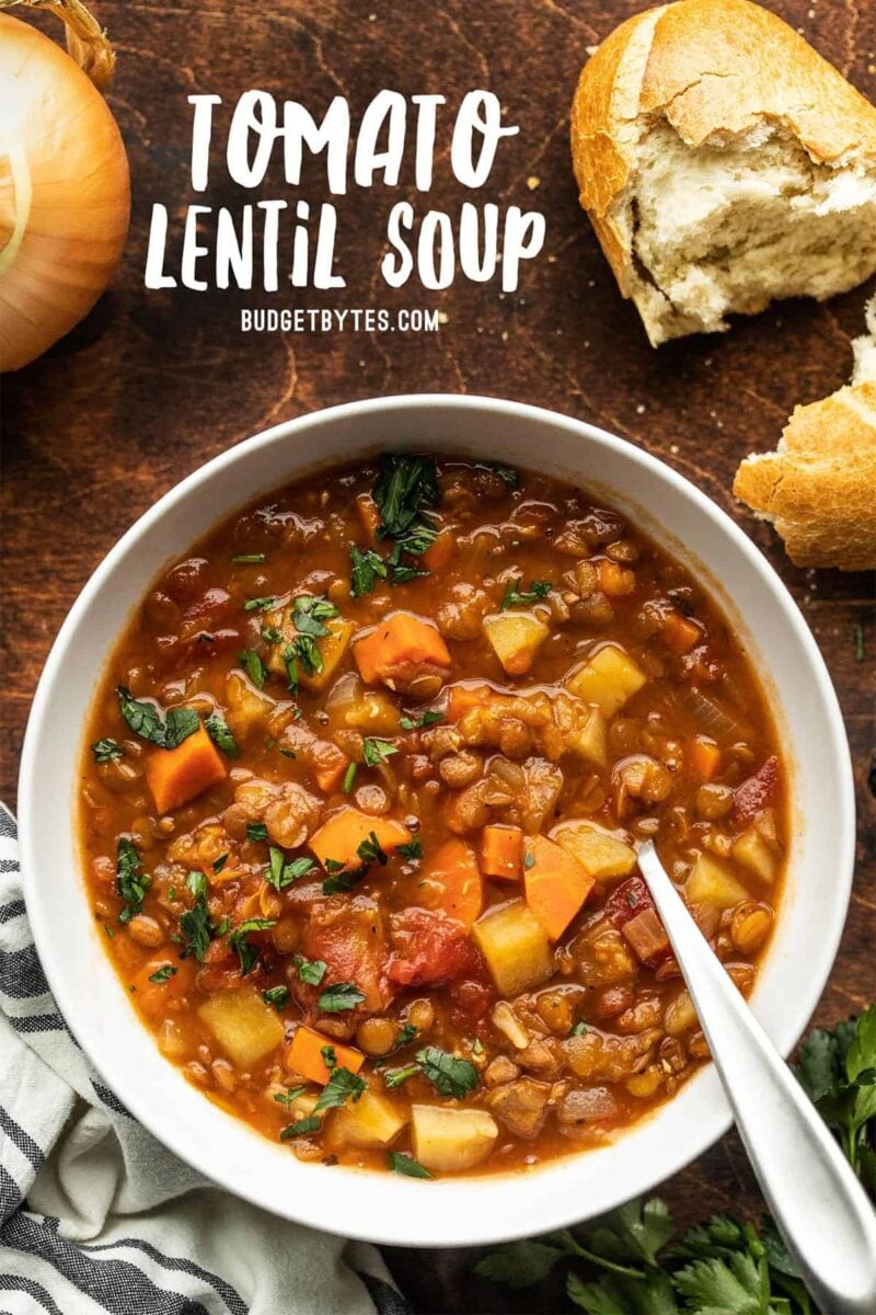 A bowl of tomato lentil soup with title text at the top