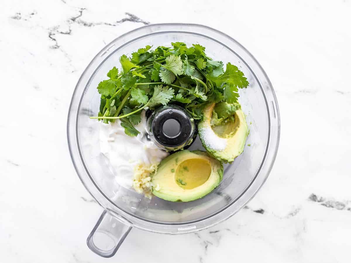 Avocado dressing ingredients in a food processor