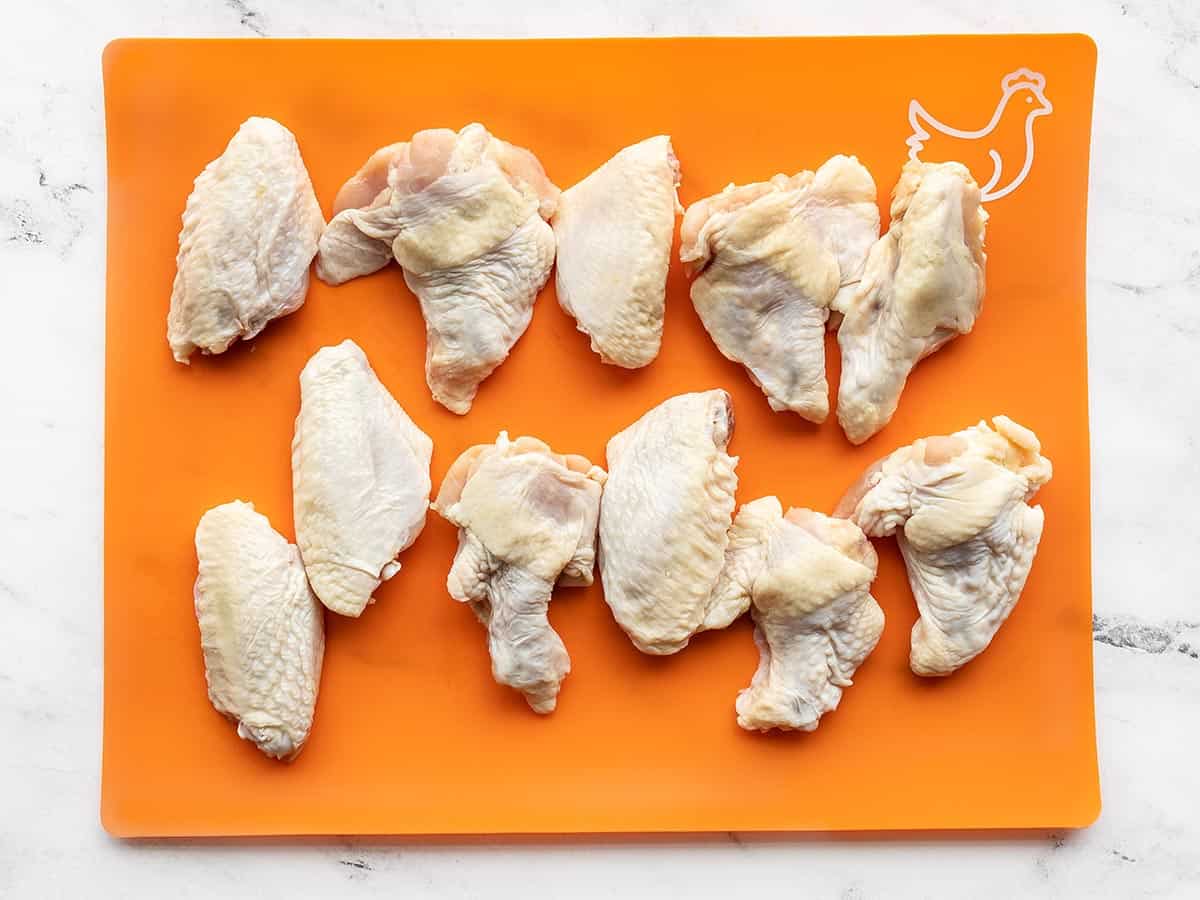 Raw chicken wings on a cutting board
