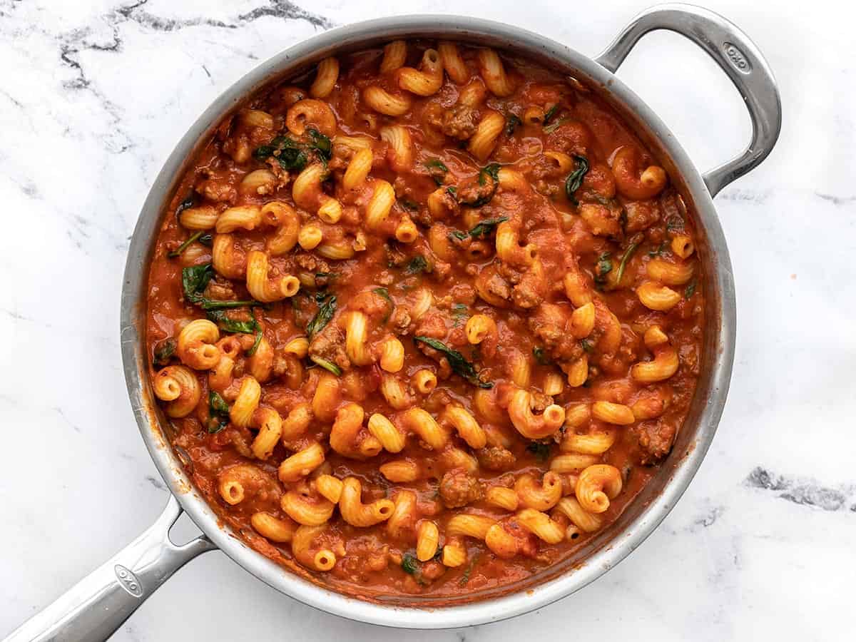 Finished creamy tomato pasta with sausage in the skillet