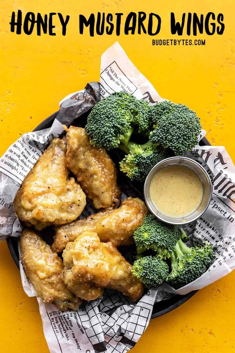 Overhead view of honey mustard wings with broccoli, title text at the top