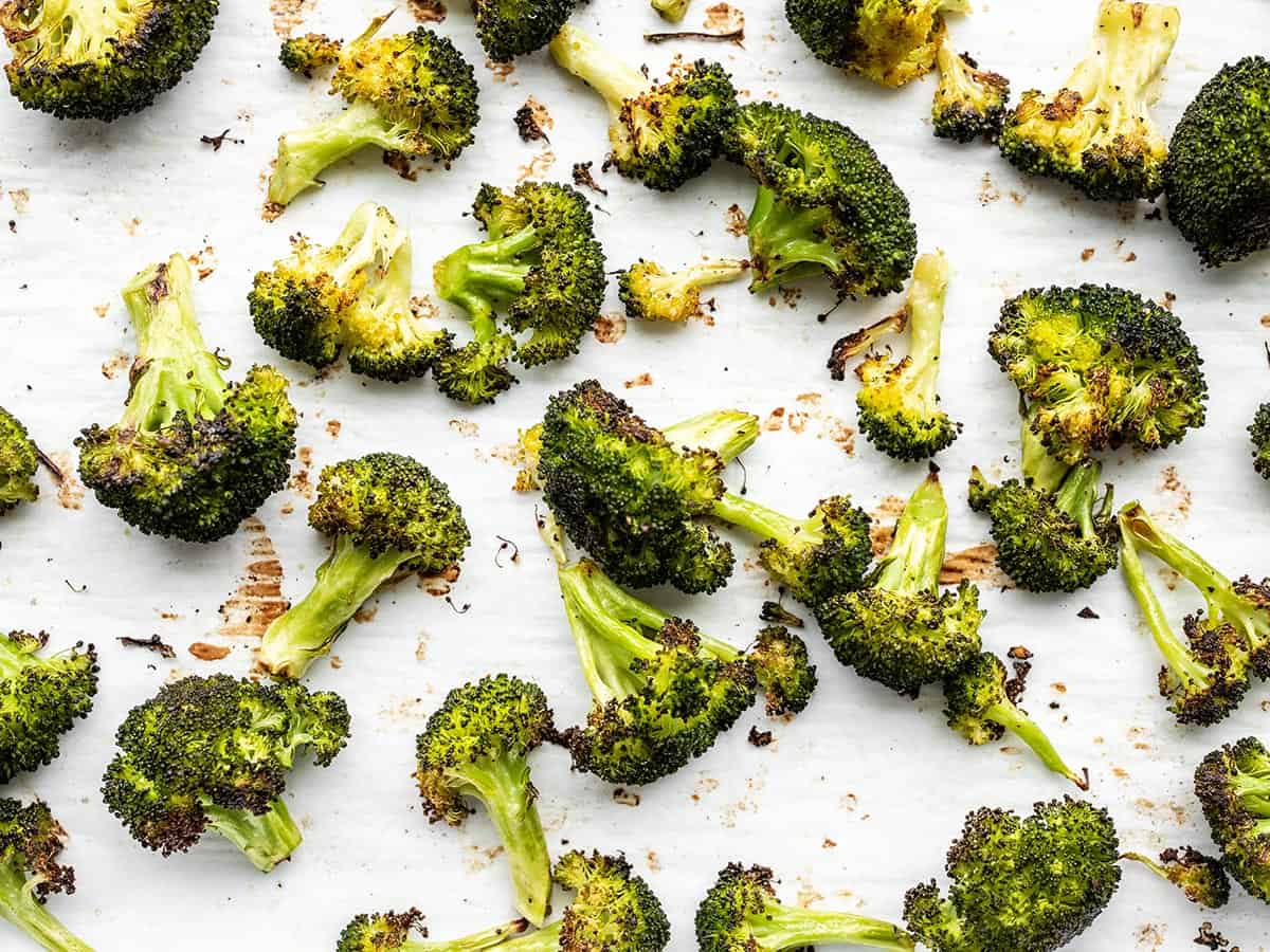 Oven roasted broccoli close up on the baking sheet