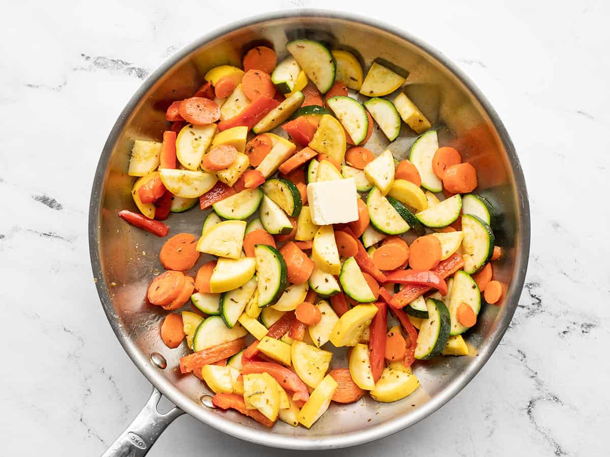 butter added to sautéed vegetables in the skillet