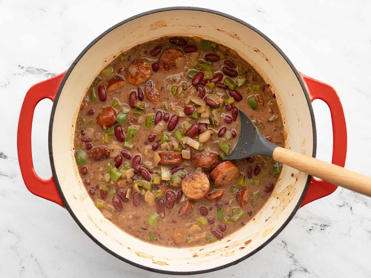 Chicken broth added to the pot, beans ready to simmer