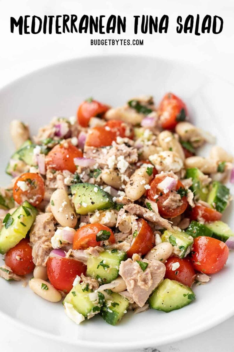 Front view of Mediterranean Tuna Salad in a bowl with title text at the top