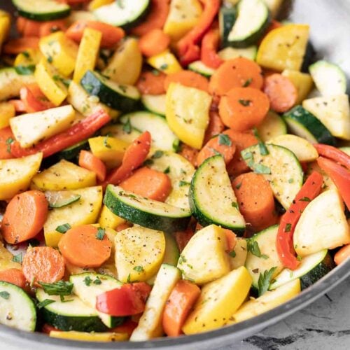 Side view of sautéed vegetables in the skillet
