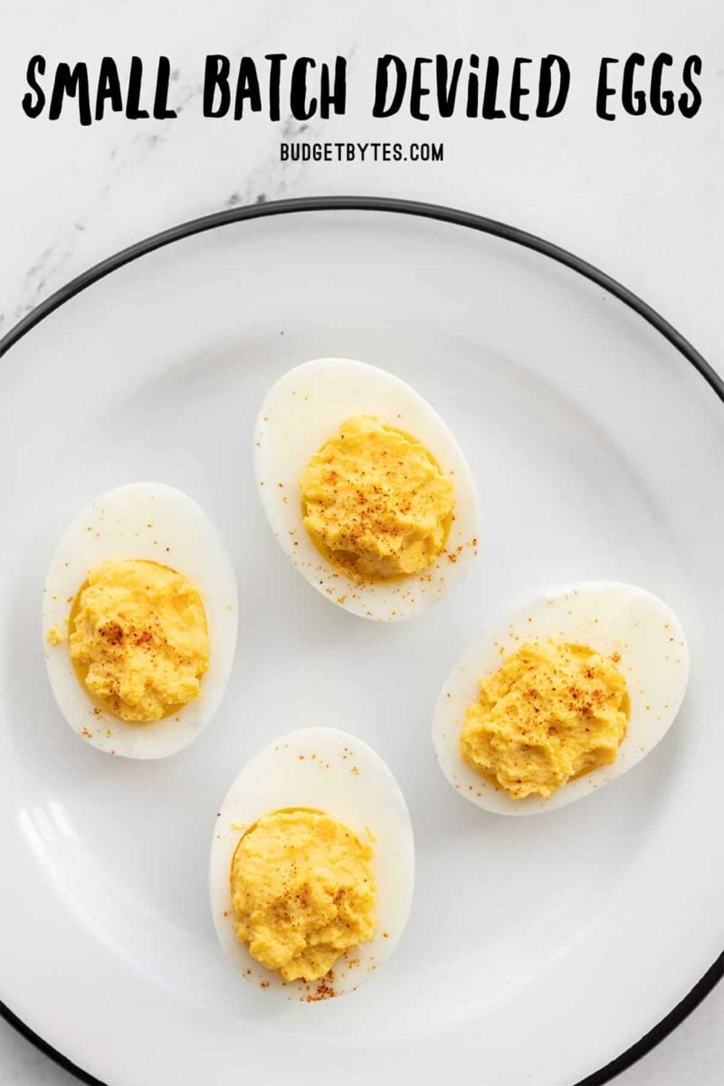 Four deviled eggs on a white plate, title text at the top
