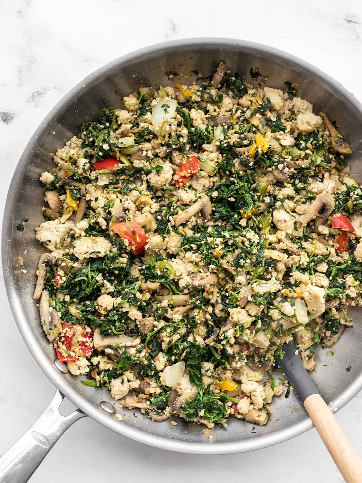 Vegetable Tofu Scramble in a skillet with a spatula