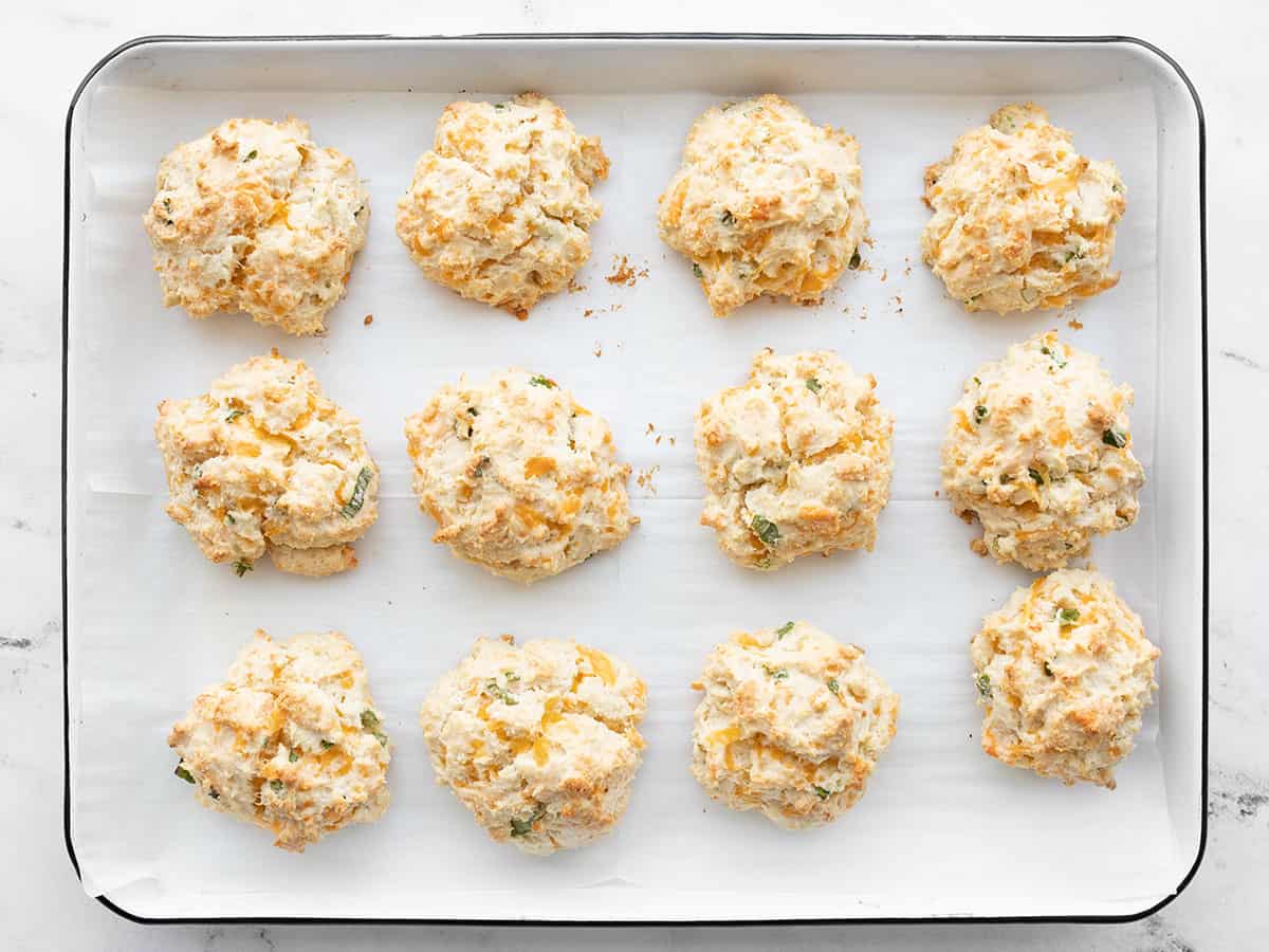 Baked cheddar drop biscuits on the baking sheet