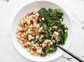 Overhead view of a Kale and White Bean Power Bowl with a fork in the side