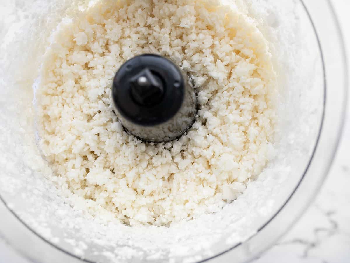 close up of minced cauliflower in the food processor