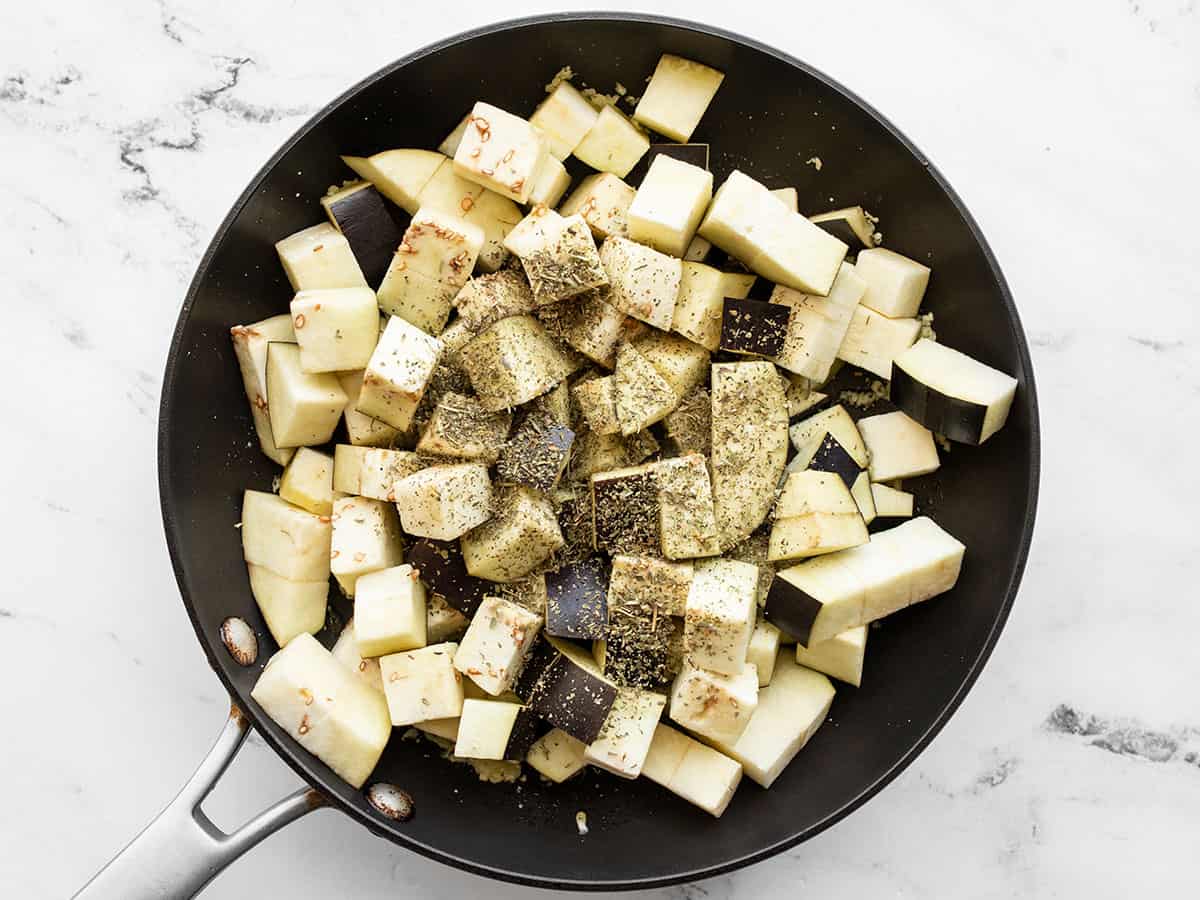 Cubed eggplant in the skillet with Italian seasoning