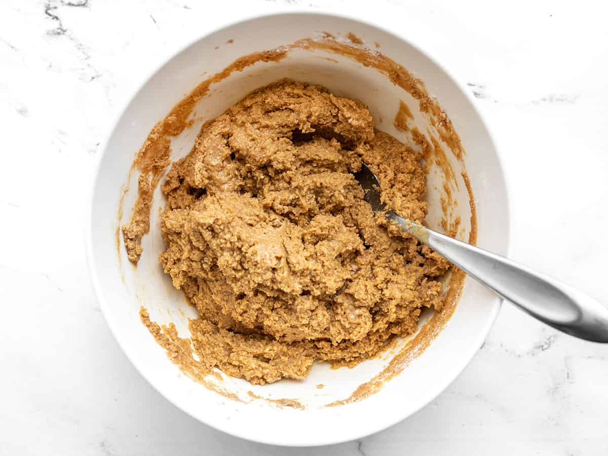 Peanut butter base mixture in the bowl with a spoon