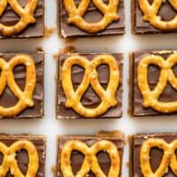 overhead view of no bake pretzel peanut butter bars lined up in a grid