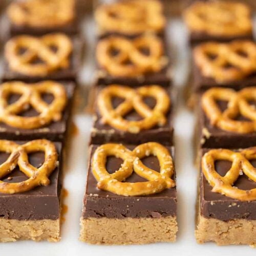 front view of no bake pretzel peanut butter bars lined up in a grid