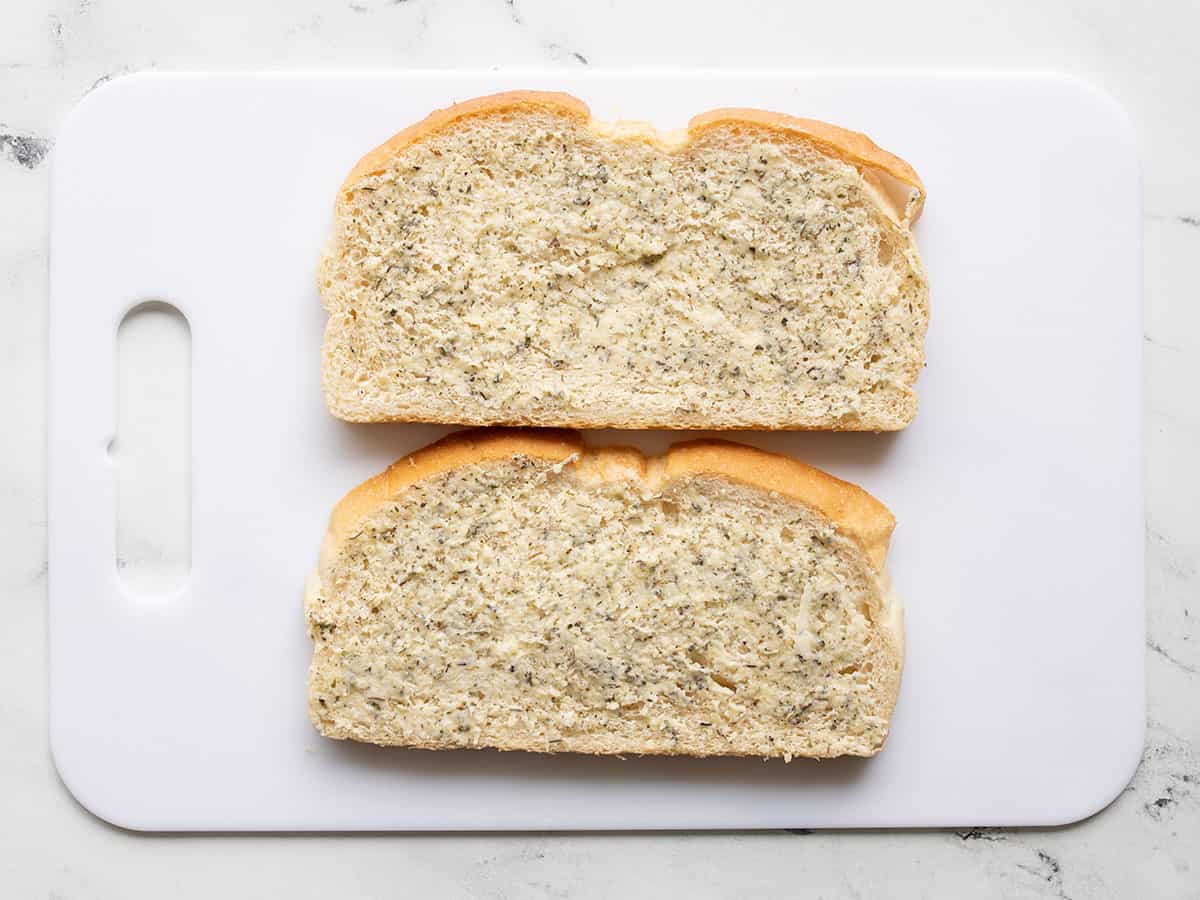 Buttered bread on a cutting board