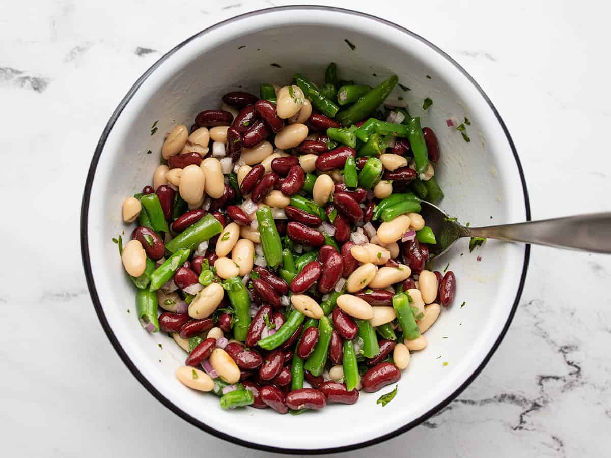 Finished three bean salad in the bowl with a spoon