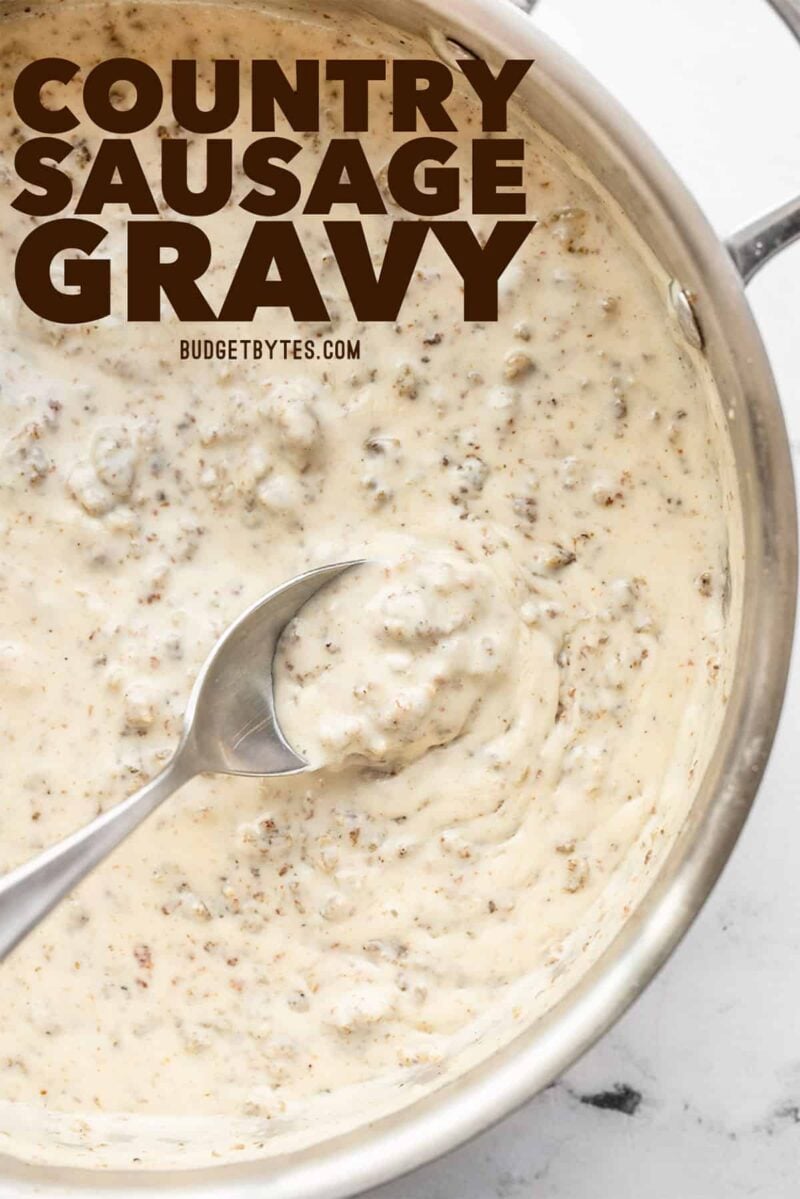 sausage gravy in a skillet with a spoon, title text at the top