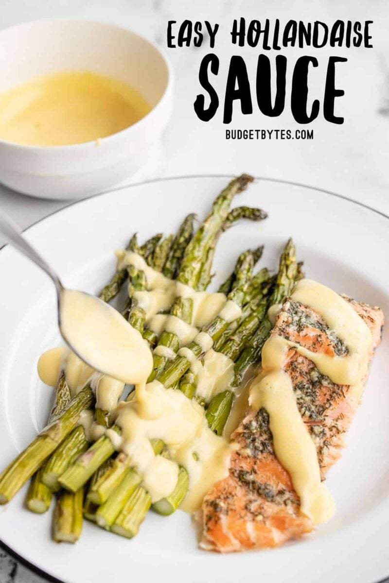 hollandaise sauce being drizzled over asparagus and salmon, title text at the top