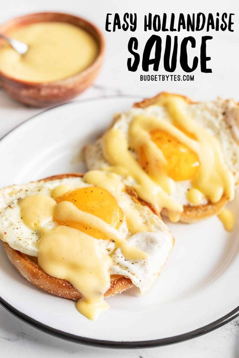 Two eggs on English muffins drizzled with hollandaise sauce, title text at the top