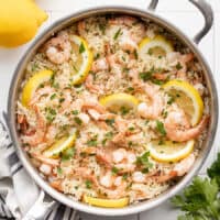 overhead view of lemon garlic shrimp and rice in a skillet
