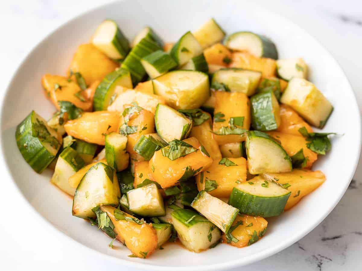 front view of a bowl full of spicy pineapple cucumber salad