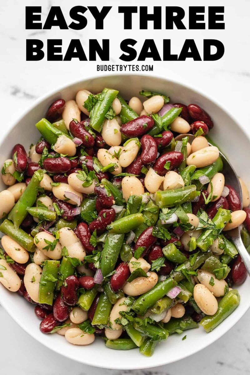 Overhead view of three bean salad with title text at the top