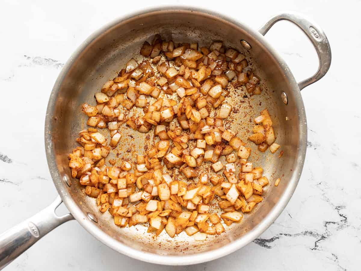 Cooked onion in the skillet with spices